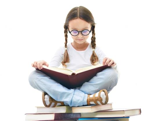 Girl on book stack